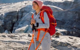 A woman enjoying a hike after finding the best King Salmon, Alaska lodging.